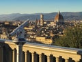 Unused telescopes to admire the view on the panoramic terrace of Piazzale Michelangelo in Florence. No tourists due to the Royalty Free Stock Photo