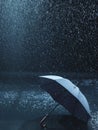 Unused umbrella lying on ground being rained upon Royalty Free Stock Photo