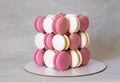 Unusual almond macaron cake. creative cake white and pink