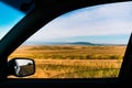 Unusual angle from the car window Panorama of a beautiful landscape with mountain ranges in Kazakhstan