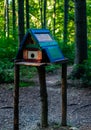 unusual birdhouse birdhouse in the park standing on three poles Royalty Free Stock Photo