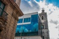 Unusual building of glass and combined with old architecture. Havana, Cuba. Royalty Free Stock Photo