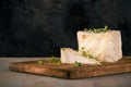 Unusual Camembert cheese with cube shape and cress