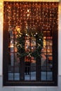 Unusual christmas wreath on window. luxury decorated store front