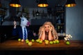 Unusual couple at bar counter in stylish kitchen