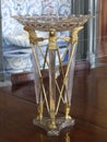 An unusual crystal vase with three eagle heads made of gold. It will become an ornament and addition to any interior