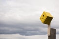 Yellow Birdhouse On A Post