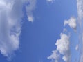 Unusual distorted white cloudscape over blue sky background Royalty Free Stock Photo