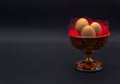 Unusual Easter on dark background. Brown eggs in hohloma vase on black background. Copy space for your text. Easter