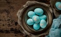 Unusual Easter on dark old background. Ceramic brown bowl with blue eggs with rabbit