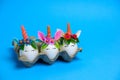 Cute unusual Easter unicorn eggs on a blue background with copy space