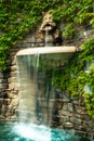 The unusual fountain, made in the form of a royal head, from the mouth of which water flows Royalty Free Stock Photo