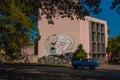 Unusual graffiti on the house, drawing on the wall: The man leaned over with the bitten globe in his hand. Havana. Cuba