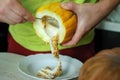 Unusual Halloween melon, cutting process, knife and male hands