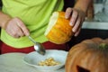 Unusual Halloween melon, cutting process, knife and male hands