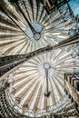 An unusual light roof over the Sony center in Berlin and its reflection in the glass windows of an office building