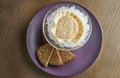 An unusual, luxury delicacy is pike caviar in a shell on ice. Wooden background. Tasty food. Film effect during post. Soft focus