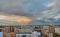 Unusual multicolored clouds over the city during sunset. Clouds over high-rise residential buildings in a residential area of the Royalty Free Stock Photo