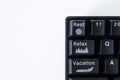 Unusual office computer keyboard interface with rest, relax and vacation buttons. The concept of solving the problem of overwork Royalty Free Stock Photo