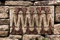 An unusual pattern of old farm tools set into a stone wall Royalty Free Stock Photo
