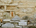 Unusual random shapes stone wall closeup