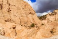 Close up of triangular rock formations against grey dark sky in Kasha-Katuwe Tent Rocks National Monument in New Mexico Royalty Free Stock Photo