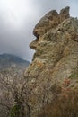 Unusual rock shape similar to human face profile. Landscape of Karadag Reserve in spring. Crimea Royalty Free Stock Photo