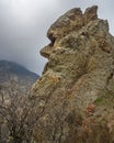 Unusual rock shape similar to human face profile. Landscape of Karadag Reserve in spring. Crimea Royalty Free Stock Photo