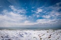 Unusual snow covers the sand of Naples beach, extraordinary snowfall on the coast of Naples, Italy