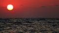 unusual sunset of the red sun over sea Royalty Free Stock Photo