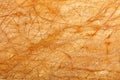 Bright orange glowing marble texture and diagonal brown cracks background Royalty Free Stock Photo