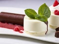 An unusual treat: white and dark chocolate cannelloni with delicate mascarpone mousse and raspberries