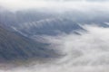 Unusual view down to smoking Bromo crater from Batok mountain on sunrise at Java island, Indonesia Royalty Free Stock Photo