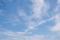 Unusual white striped wavy clouds in a bright blue sky. Heavenly background for your photos. Perfect Sky photo Royalty Free Stock Photo