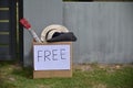 Unwanted family private items placed inside a cardboard box with free sign on it Royalty Free Stock Photo