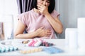 unwell Asian woman feeling nausea and want to vomit side effect of taking too much antibiotics pill can be used for Ulcerative