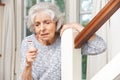 Unwell Senior Woman Using Personal Alarm At Home Royalty Free Stock Photo