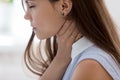 Unwell young woman touch neck suffering from angina Royalty Free Stock Photo