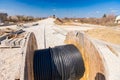 Unwinding cable of spool, coil at construction site