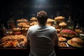 Unwise eating Rear view of man making unhealthy food choices, highlighting dietary concerns