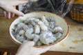 Unwrapping a bowl of shrimp Royalty Free Stock Photo