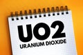 UO2 - uranium dioxide acronym text on notepad, abbreviation concept background Royalty Free Stock Photo