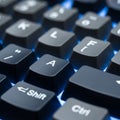 Up of a black computer keyboard with illuminated white letters Royalty Free Stock Photo