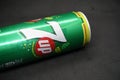 A 7up can against isolated black background
