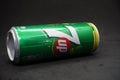 A 7up can against isolated black background