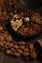 Up close mixed nuts in an old spice container Royalty Free Stock Photo