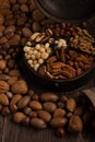 Up close mixed nuts in an old spice container