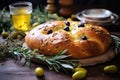 An up-close photo highlighting Tsoureki, the iconic Greek Easter bread, arranged on a table adorned with olive branches