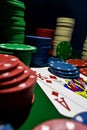 Up close photograph of playing cards and stacks of poker chips Royalty Free Stock Photo