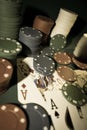 Up close photograph of playing cards and stacks of poker chips Royalty Free Stock Photo